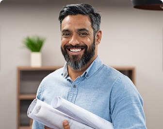 smiling employee with documents